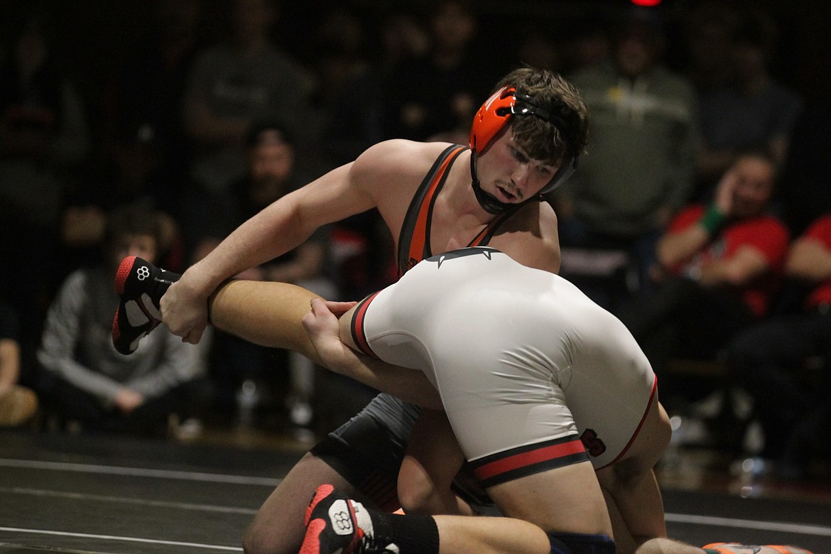 JASON ELLIOTT/Press Post Falls senior Seth Martin attempts to move Sandpoint senior Jorden Tyler around the circle during the 195-pound championship at the Tri-State Invitational on Saturday at North Idaho College.