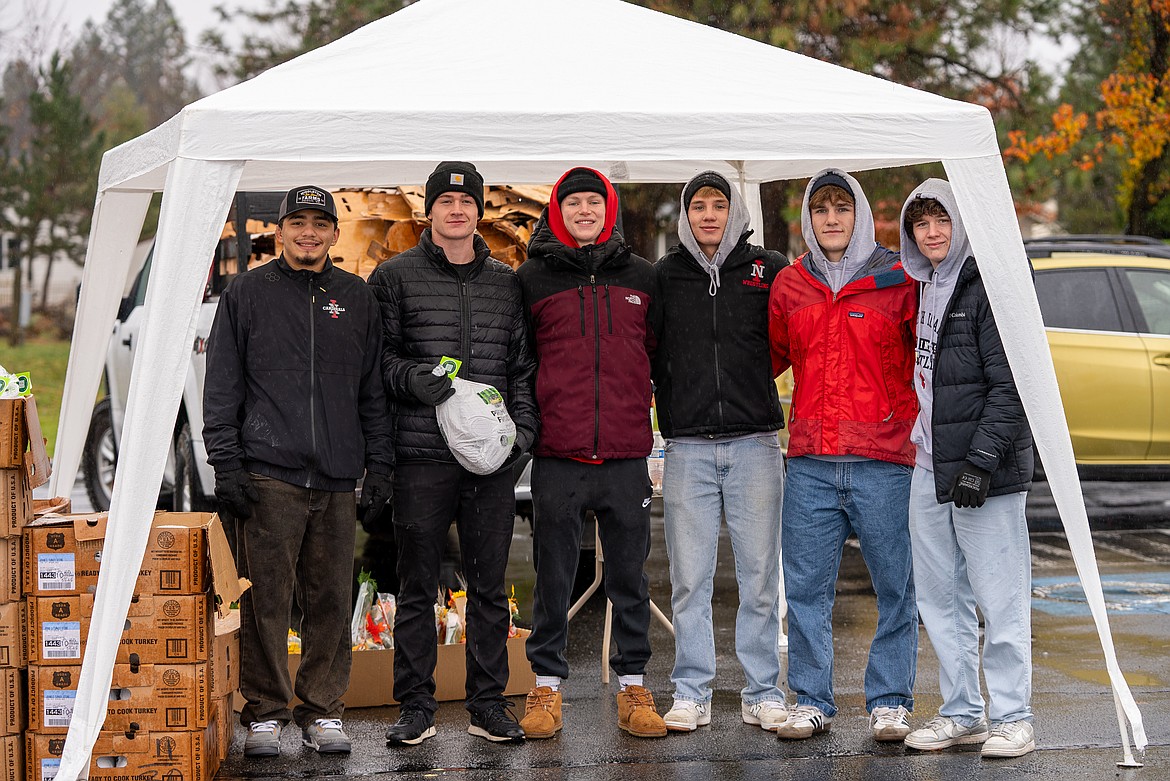 NIC ATHLETICS North Idaho College wrestlers Jermiah Zuniga, Bryson Hansen, Ben Whitright, Dylan Block, Jackson Lougen and Joe Sullivan pose for a photo during a Turkeys and More drive-thru event at Unity Church in Coeur d’Alene.