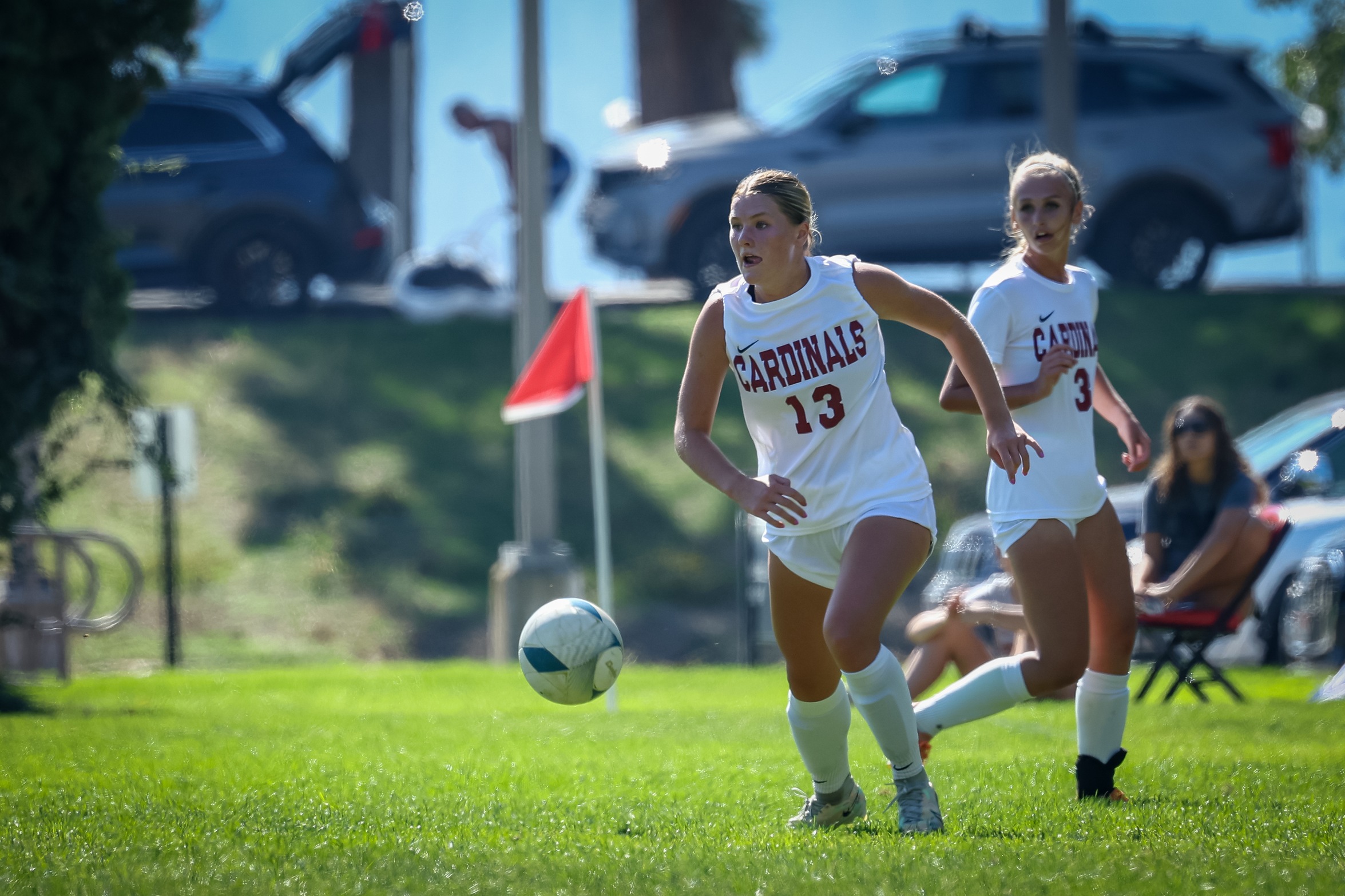 NIC women's soccer player Adison Stoddard brings ball up the field