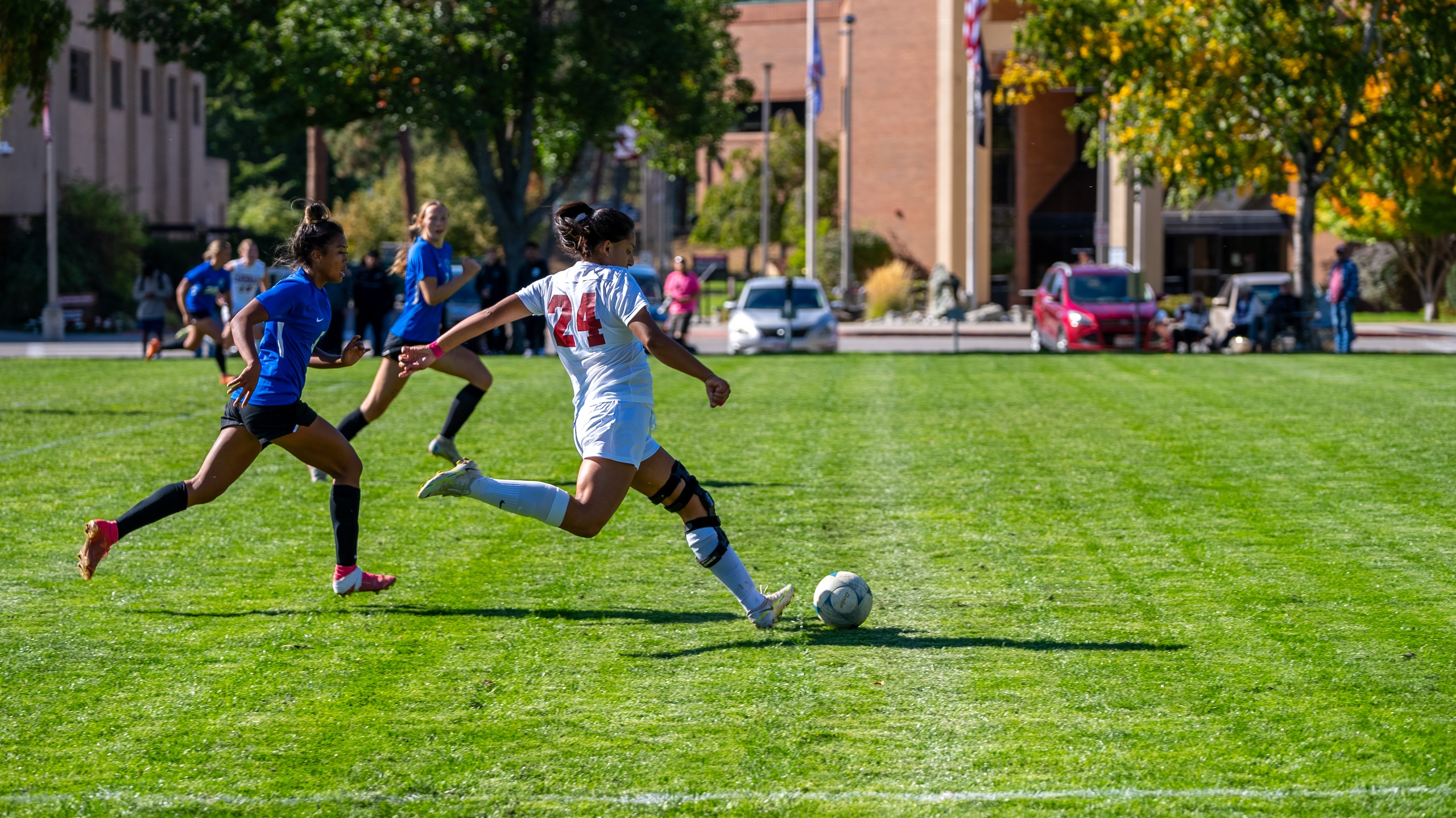NIC women's soccer player Teresa Ledezma gets ball past Blue Mountain defenders.